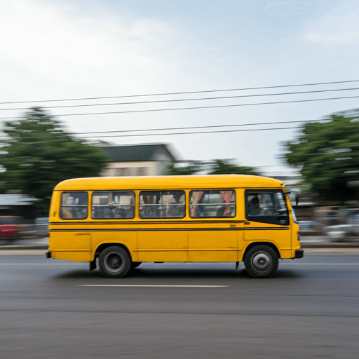 Yellow Danfo bus moving fast through busy Lagos street